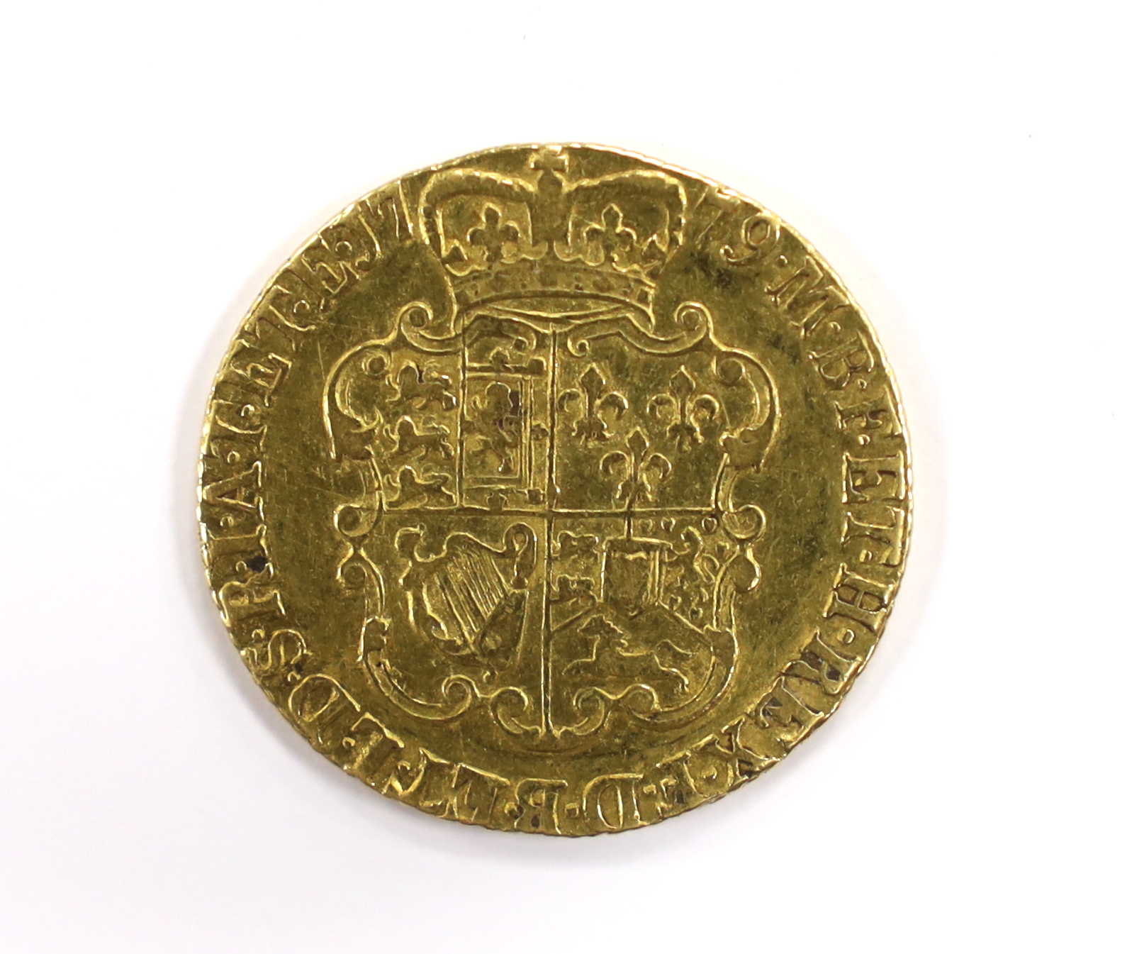 British gold coins - A George III gold guinea, 1779, fourth head, VF, (S3728), Provenance - bought from Richard Lobel and co, London, 7th March 1977 for £170.